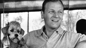 Photograph Of Les Baxter With A Dog At His Side.