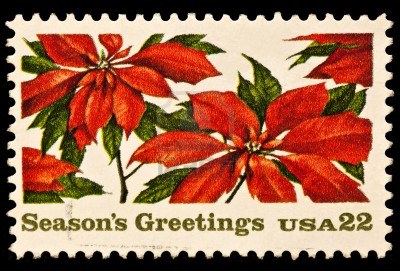 22-cent USA stamp with poinsettias, reads "Season's Greetings"