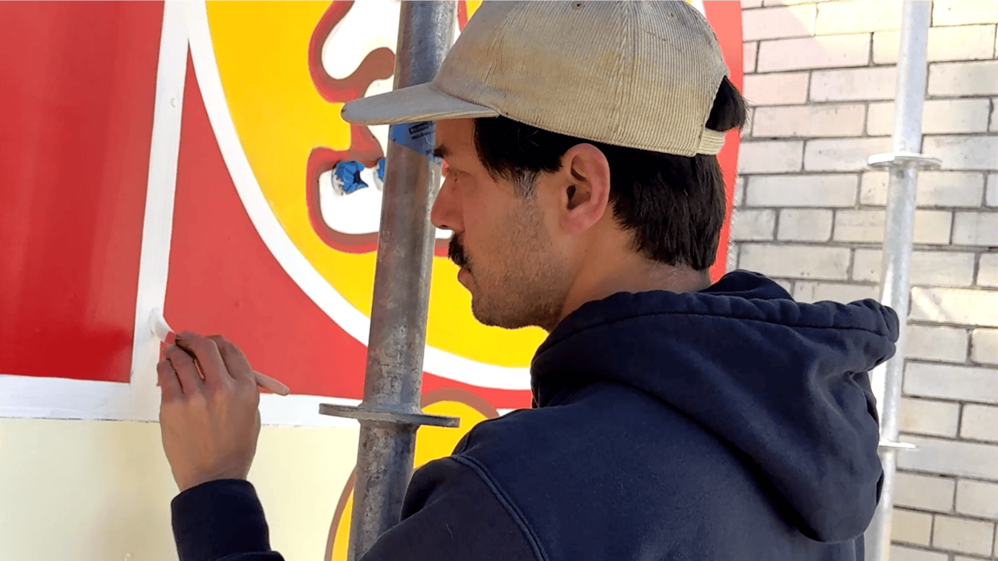 Manny Fabregas Hand Painting Details On The Golden Star Radio Sign