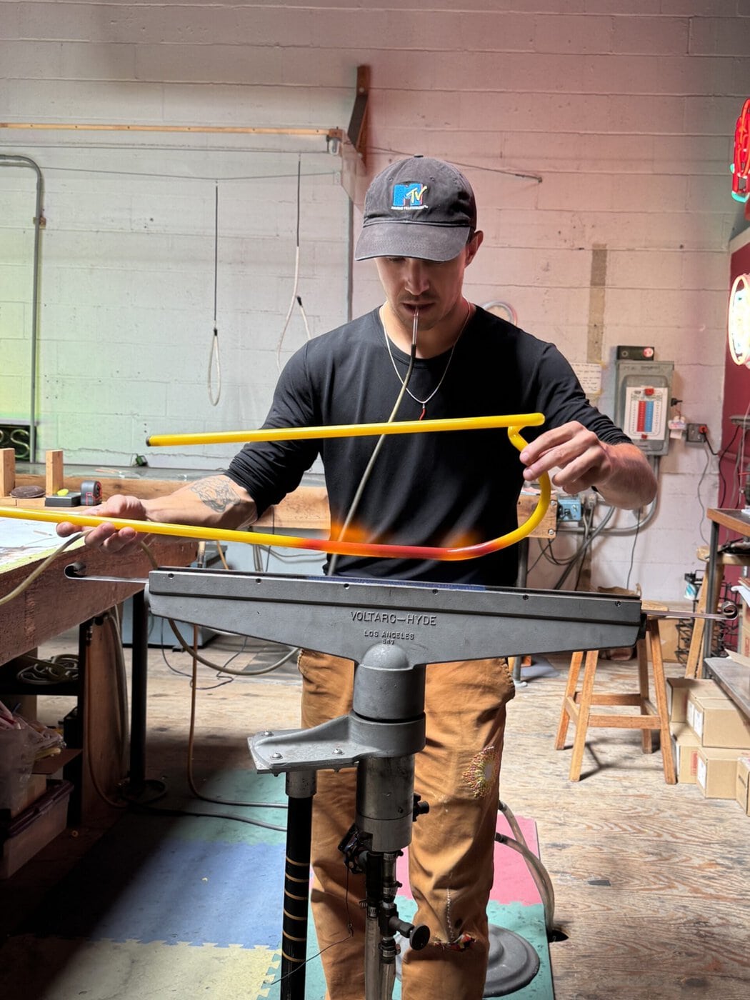 Adam Taylor Heating And Bending Neon Glass Tubing For The Golden Star Radio Sign