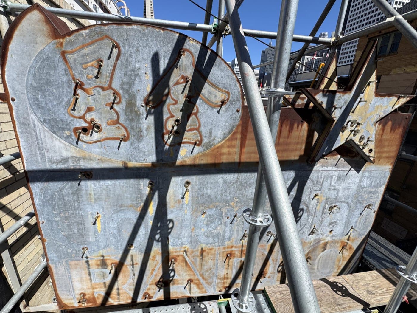 Golden Star Radio Sign With Neon Removed, Revealing Faded Paint And Weathered Metal