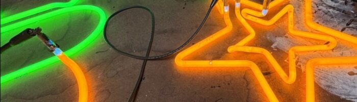 Original Golden Star Radio neon tubes illuminated during restoration